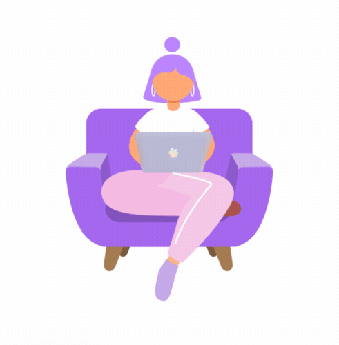 A developer sitting in an armchair programming on her laptop.